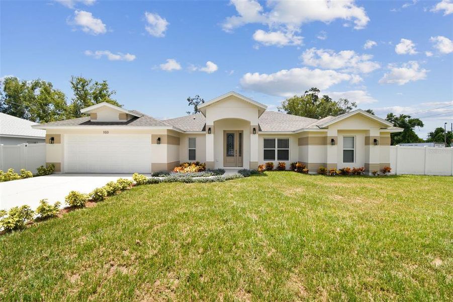 Front exterior of a new home in , Lutz, FL, highlighting curb appeal (Image 21).