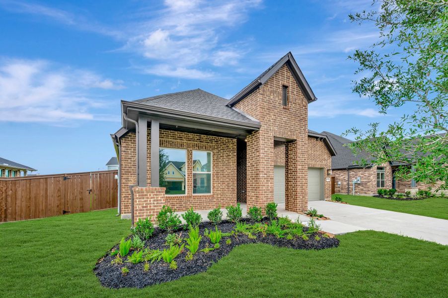 Front exterior of a new home in Beacon Point at Lago Mar - Retreat Collection, Texas City, TX, highlighting curb appeal (Image 26). Front exterior of a new home in Beacon Point at Lago Mar - Retreat Collection, Texas City, TX, highlighting curb appeal (Image 26).