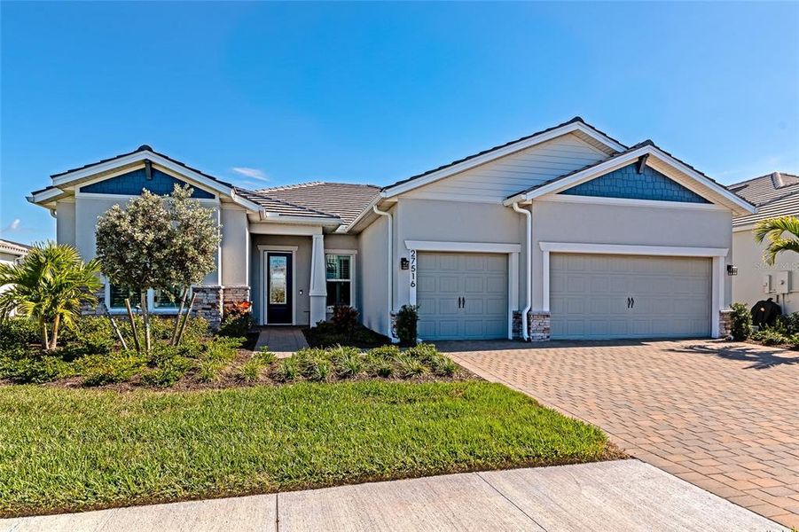 Front exterior of a new home in , Englewood, FL, highlighting curb appeal (Image 25). Front exterior of a new home in , Englewood, FL, highlighting curb appeal (Image 25).