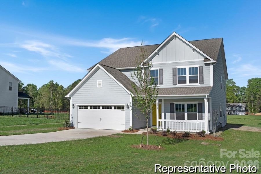 Front exterior of a new home in Whispering Hills, Locust, NC, highlighting curb appeal (Image 1). Front exterior of a new home in Whispering Hills, Locust, NC, highlighting curb appeal (Image 1).