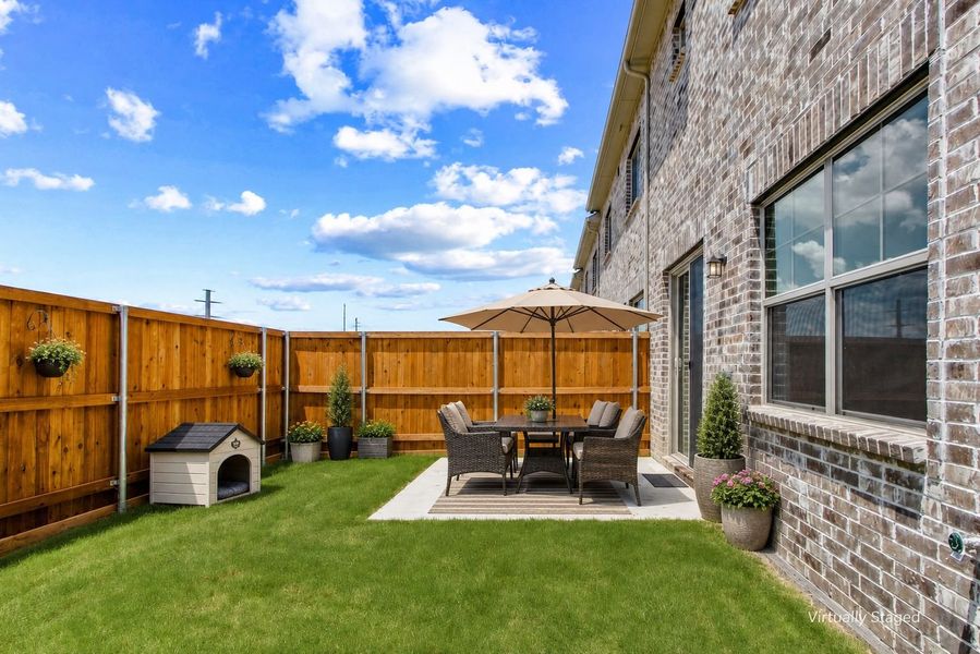 Exterior details and patio area of a home in Wildridge, Oak Point (Image 27).