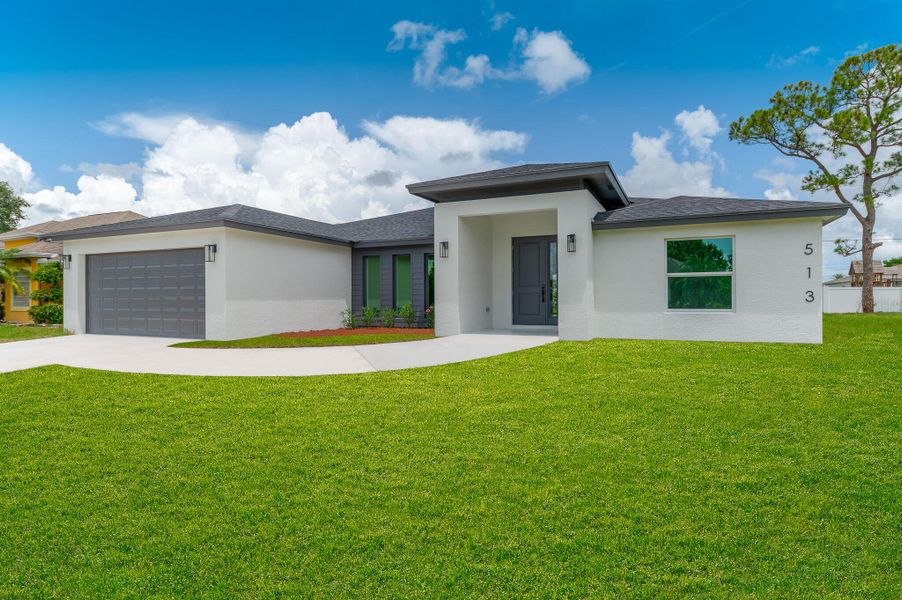 Front exterior of a new home in , Port St. Lucie, FL, highlighting curb appeal (Image 1). Front exterior of a new home in , Port St. Lucie, FL, highlighting curb appeal (Image 1).
