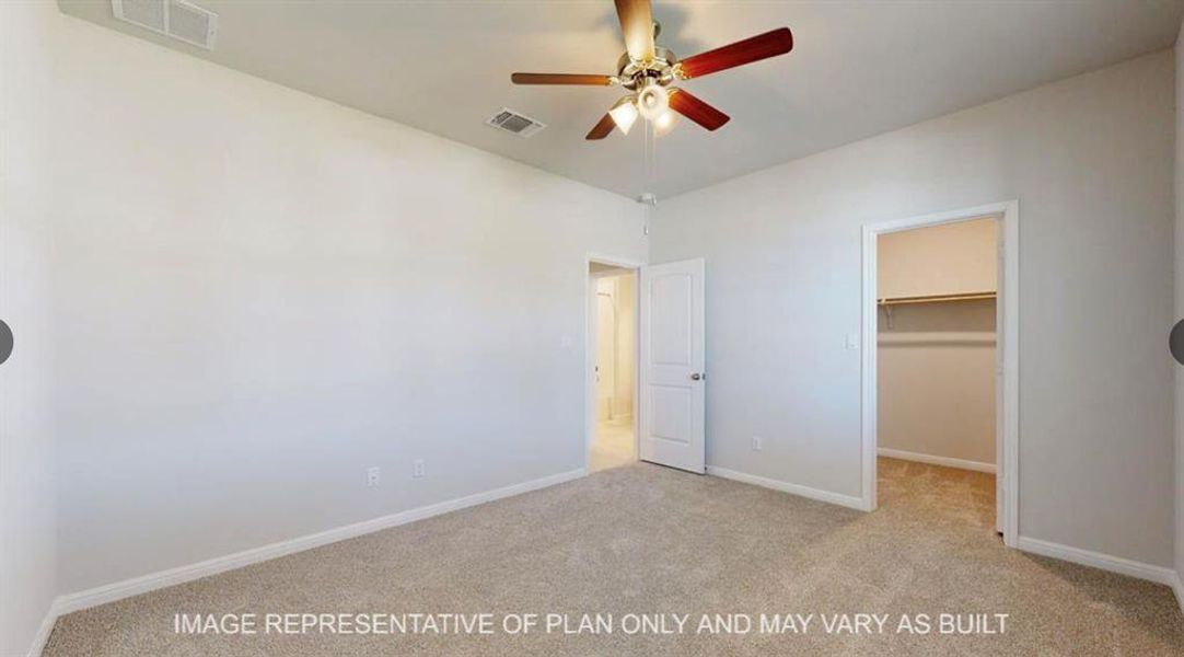 Unfurnished bedroom with visible vents, a spacious closet, and carpet flooring Unfurnished bedroom with visible vents, a spacious closet, and carpet flooring