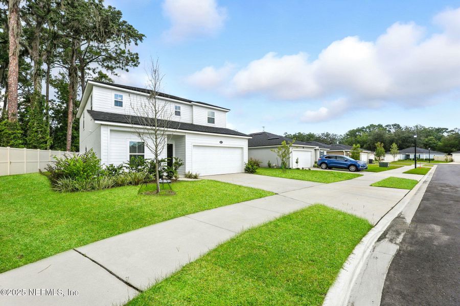 Front exterior of a new home in , Jacksonville, FL, highlighting curb appeal (Image 22).