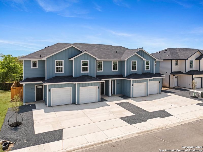 Front exterior of a new home in The Preserve at Candlemeadow, San Antonio, TX, highlighting curb appeal (Image 2).