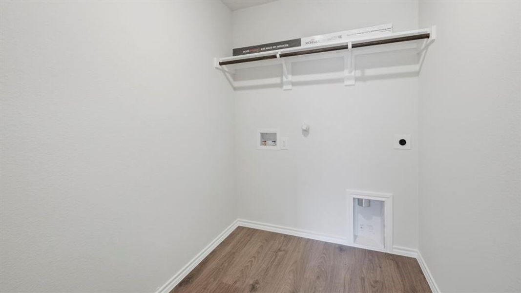 Laundry area with gas dryer hookup, dark wood-style flooring, washer hookup, and hookup for an electric dryer Laundry area with gas dryer hookup, dark wood-style flooring, washer hookup, and hookup for an electric dryer