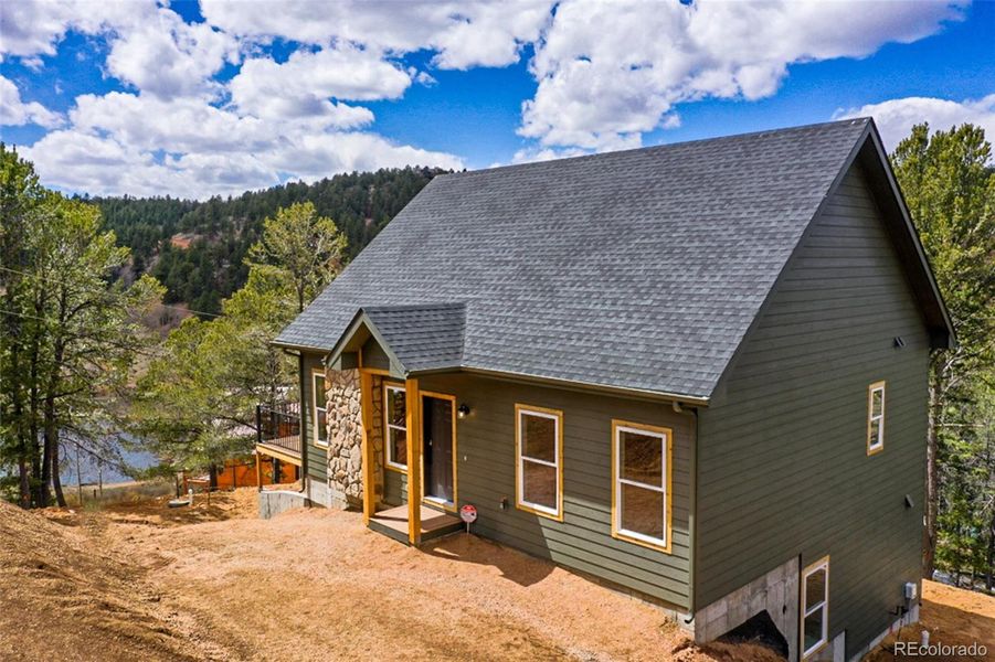 Front exterior of a new home in , Divide, CO, highlighting curb appeal (Image 22). Front exterior of a new home in , Divide, CO, highlighting curb appeal (Image 22).