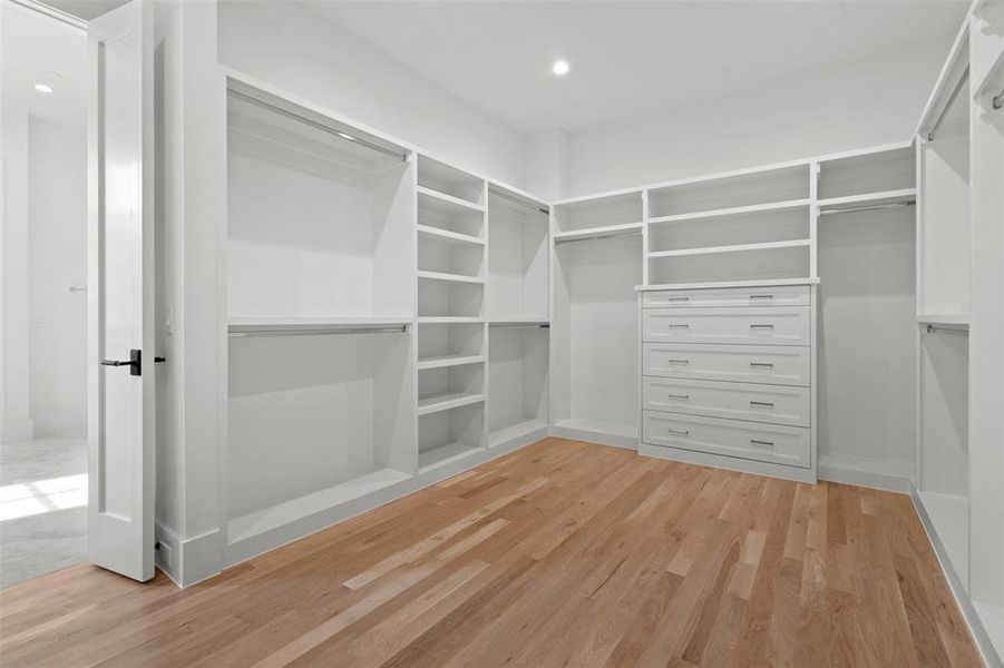 Walk in closet featuring light wood-style flooring