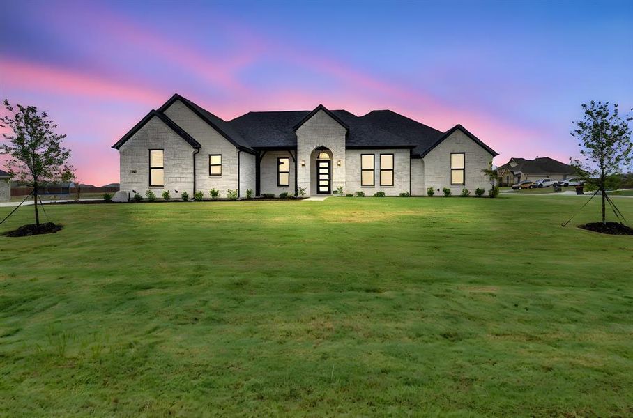 Front exterior of a new home in Springside Estates II, Waxahachie, TX, highlighting curb appeal (Image 20). Front exterior of a new home in Springside Estates II, Waxahachie, TX, highlighting curb appeal (Image 20).