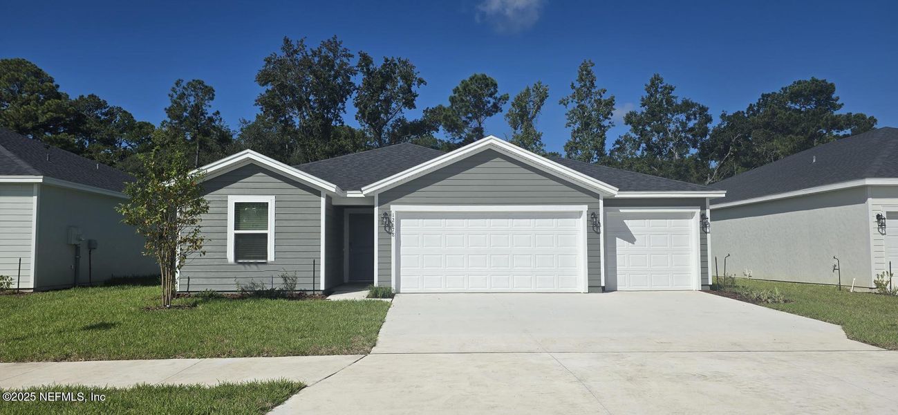 Front exterior of a new home in Azalea Creek, Jacksonville, FL, highlighting curb appeal (Image 2).