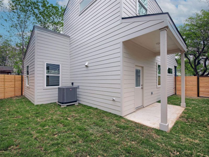 View of home's exterior featuring a fenced backyard and a patio