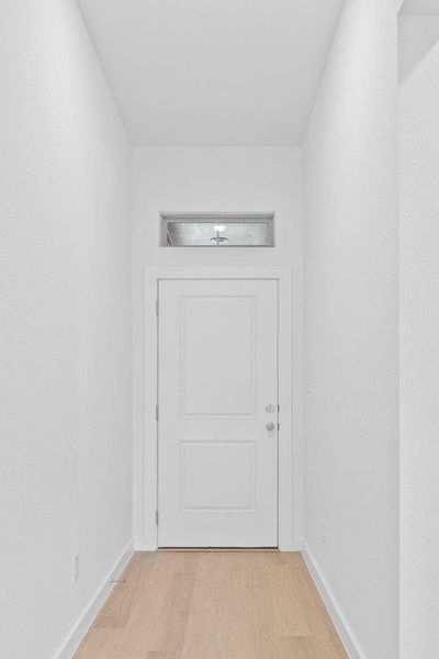 Entry in the Quartz home plan by Trophy Signature Homes – REPRESENTATIVE PHOTO Entry in the Quartz home plan by Trophy Signature Homes – REPRESENTATIVE PHOTO