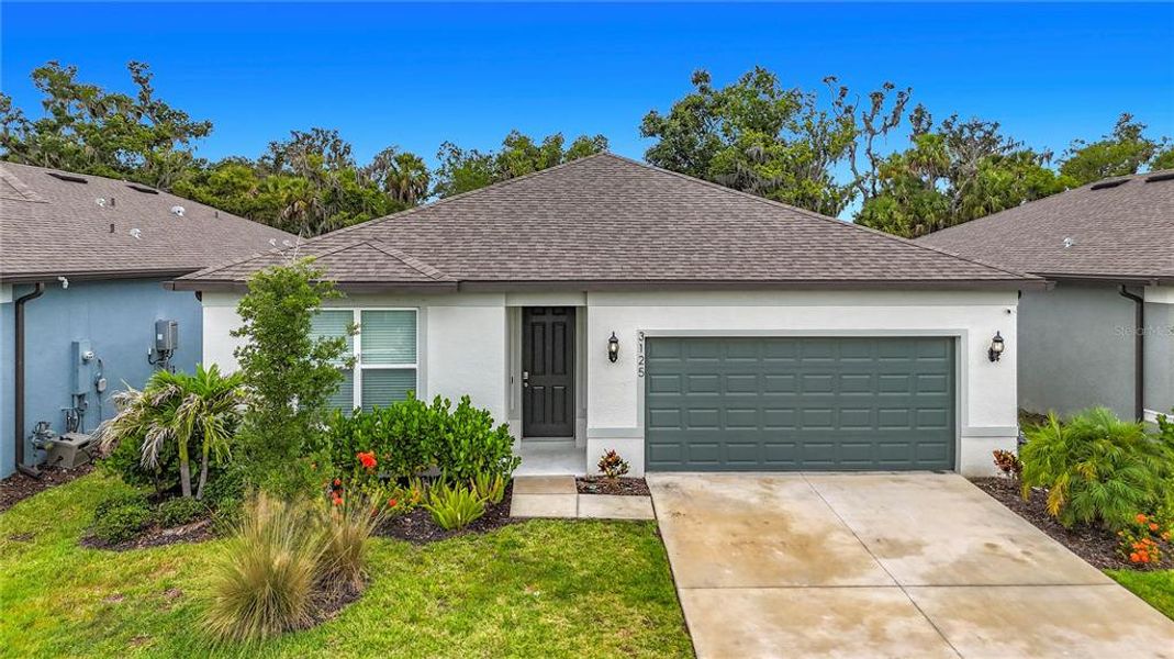 Front exterior of a new home in , Ellenton, FL, highlighting curb appeal (Image 21). Front exterior of a new home in , Ellenton, FL, highlighting curb appeal (Image 21).