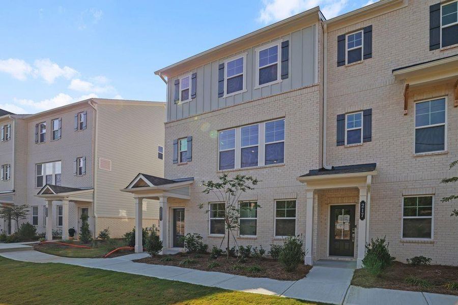 Front exterior of a new home in Somerset at Veterans Memorial, Mableton, GA, highlighting curb appeal (Image 24). Front exterior of a new home in Somerset at Veterans Memorial, Mableton, GA, highlighting curb appeal (Image 24).