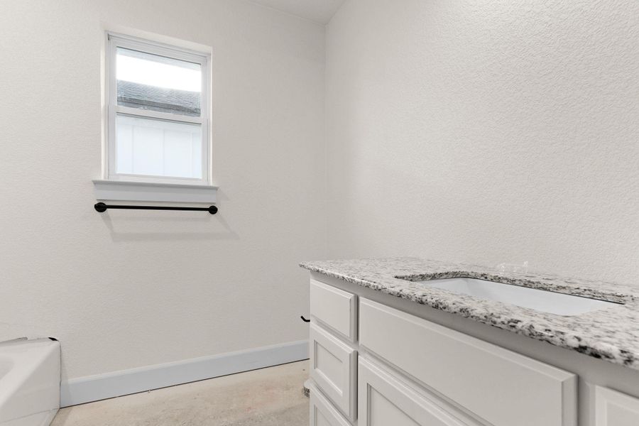 Full bathroom featuring vanity and a bathtub Full bathroom featuring vanity and a bathtub