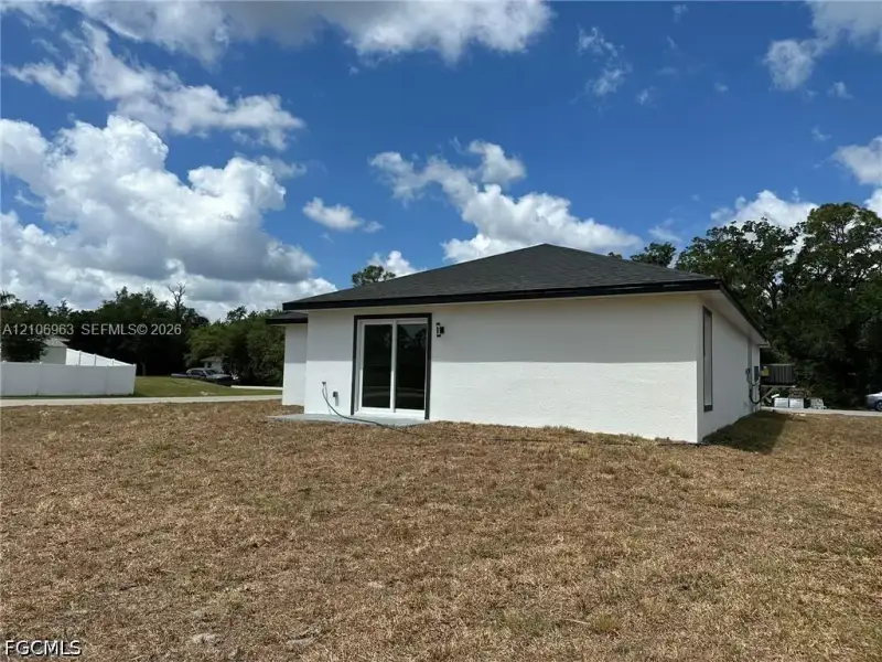 Exterior details and patio area of a home in , Port Charlotte (Image 3).
