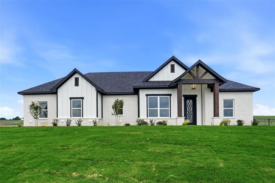 Front exterior of a new home in , Springtown, TX, highlighting curb appeal (Image 29).