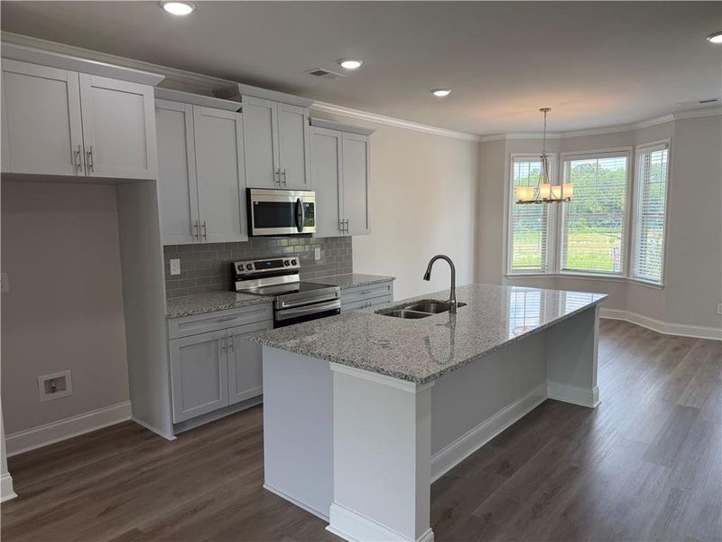 Furnished interior view inside a new home in Towns at Enclave, Lawrenceville (Image 6). Furnished interior view inside a new home in Towns at Enclave, Lawrenceville (Image 6).