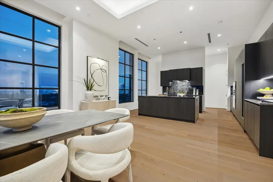 The dining area is seamlessly connected to the kitchen highlighting the home's open design, where every detail is thoughtfully crafted. The dining area is seamlessly connected to the kitchen highlighting the home's open design, where every detail is thoughtfully crafted.