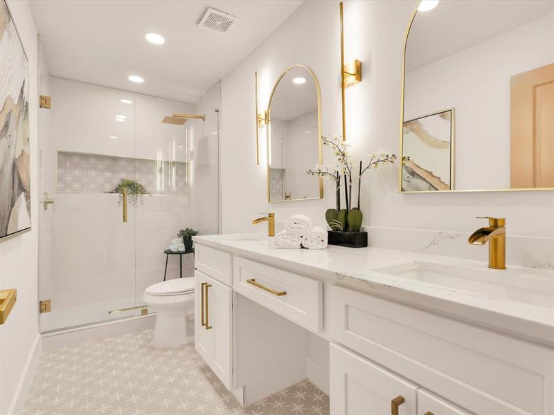 Bathroom featuring a shower with door, vanity, and toilet