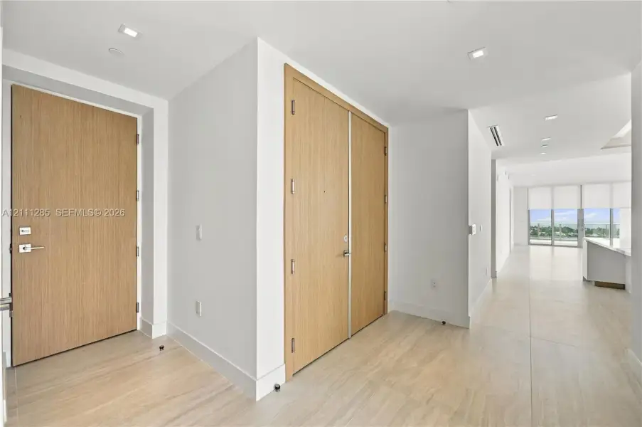 Solid wood-finish doors, large-format tile flooring, and recessed ceiling lighting Solid wood-finish doors, large-format tile flooring, and recessed ceiling lighting