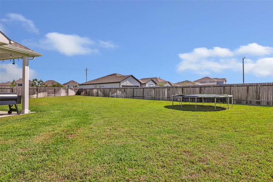Exterior details and patio area of a home in Granger Pines, Conroe (Image 4).