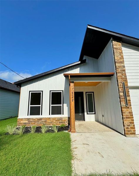 Front exterior of a new home in , Greenville, TX, highlighting curb appeal (Image 8).