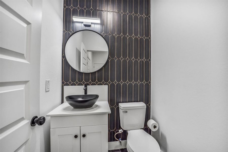 Stylish half bath located on the 1st floor.
