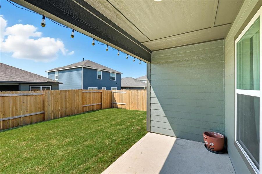 Fenced backyard featuring a patio area