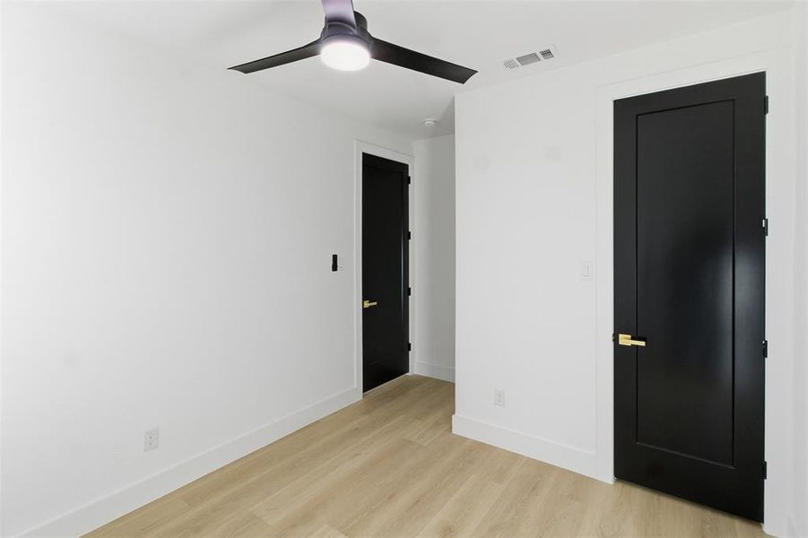 Unfurnished bedroom with light wood-style flooring and ceiling fan