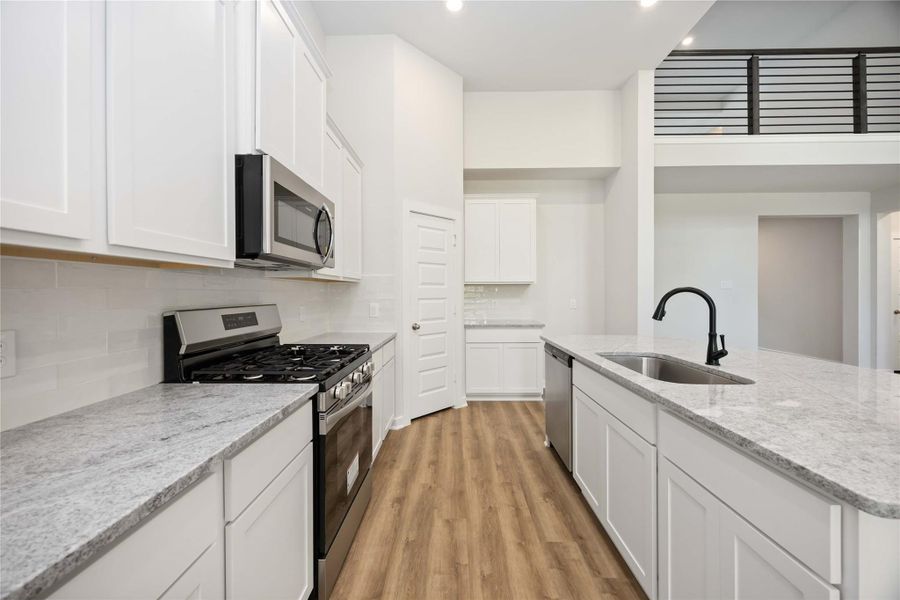 Furnished interior view inside a new home in Deer Pines, Conroe (Image 7).