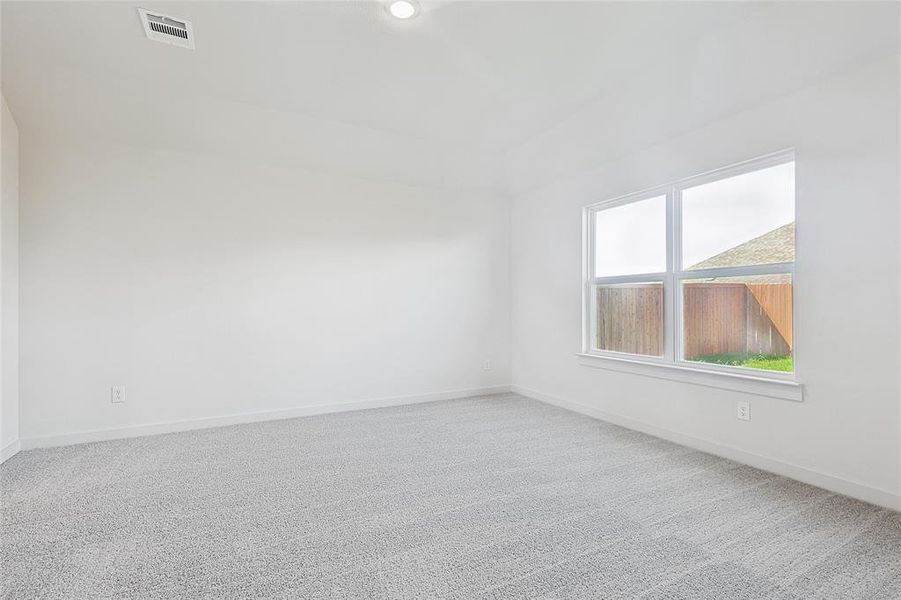 Unfurnished room featuring carpet flooring