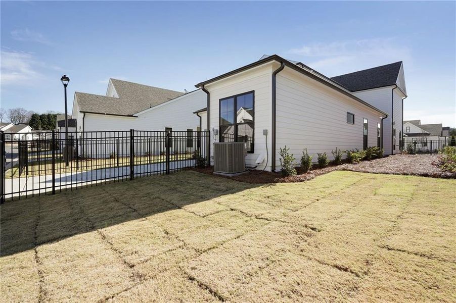 Exterior details and patio area of a home in Promenade at Sawnee Village, Cumming (Image 29).