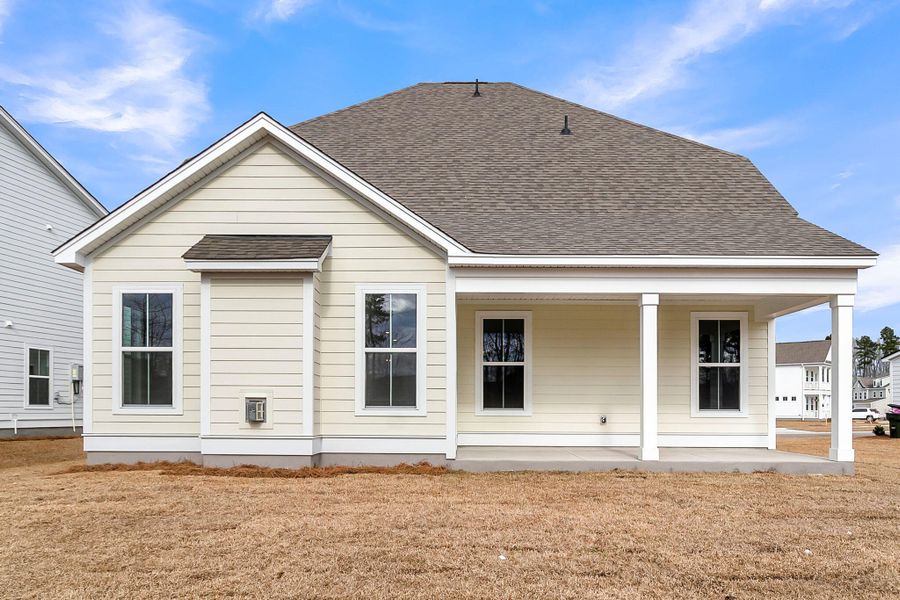 Exterior details and patio area of a home in Tidewater at Lakes of Cane Bay, Summerville (Image 23).
