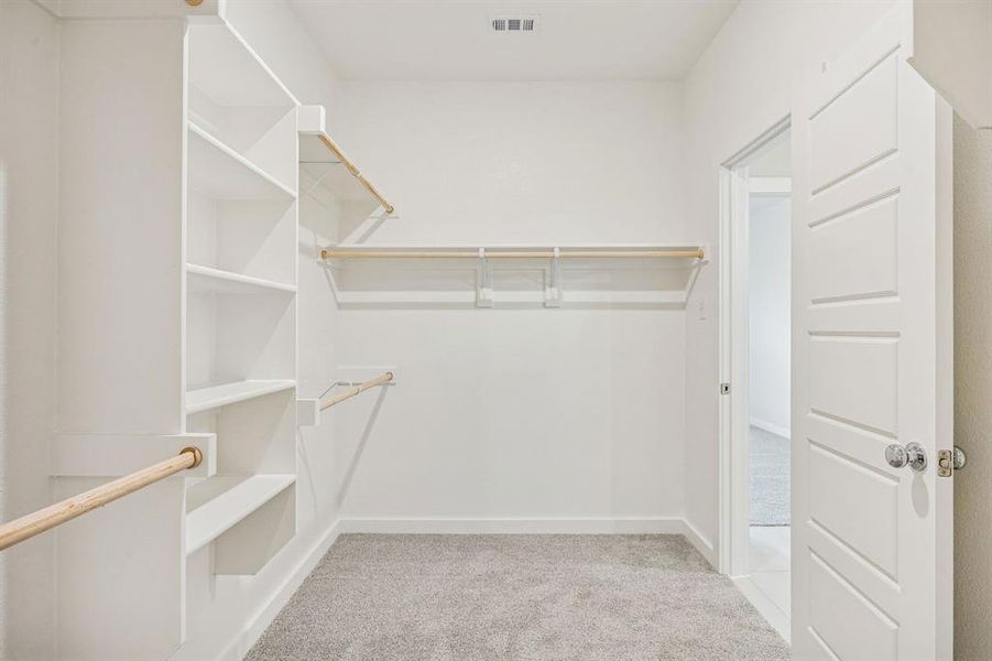 Primary Closet in the Stanley II home plan by Trophy Signature Homes – REPRESENTATIVE PHOTO