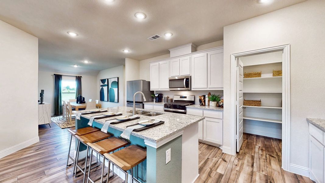 A kitchen with white cabinets. A kitchen with white cabinets.
