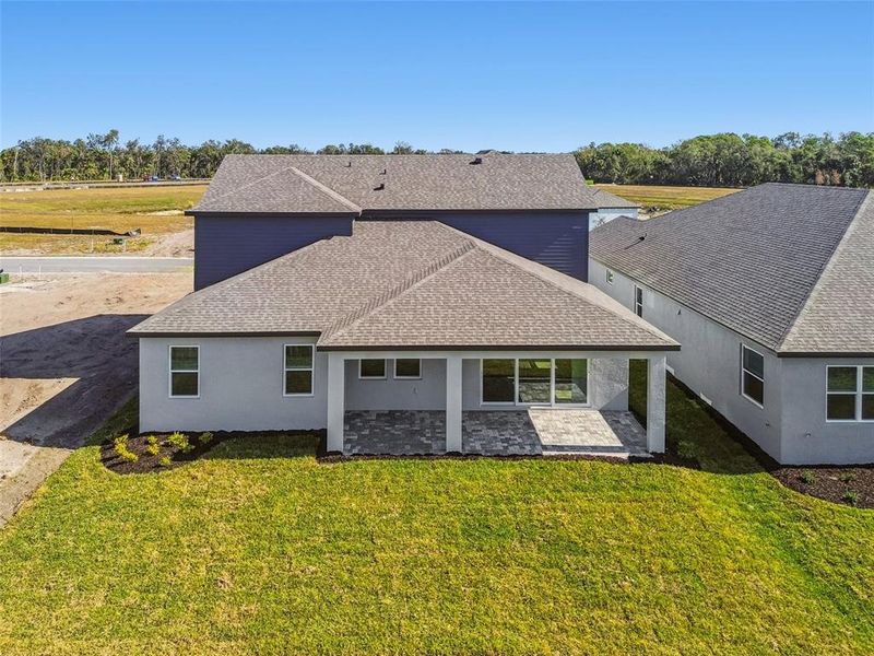 Exterior details and patio area of a home in Creeks Edge at Twin Rivers, Parrish (Image 31).