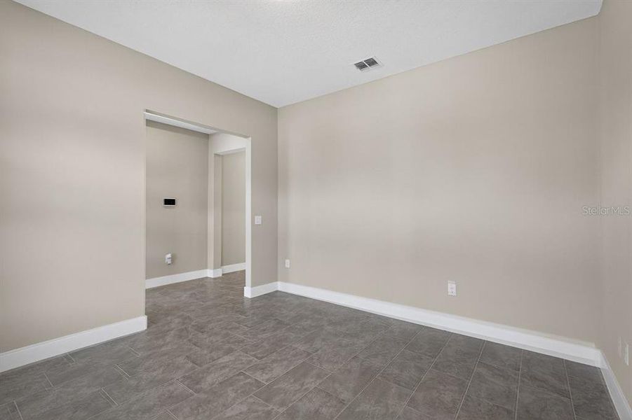 Spacious, unfurnished interior of a new home in Gray Hawk at Hole Two, Daytona Beach (Image 42).