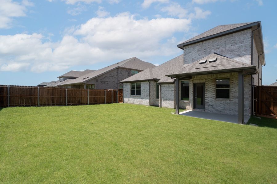 Exterior details and patio area of a home in Valencia on the Lake, Little Elm (Image 2). Exterior details and patio area of a home in Valencia on the Lake, Little Elm (Image 2).