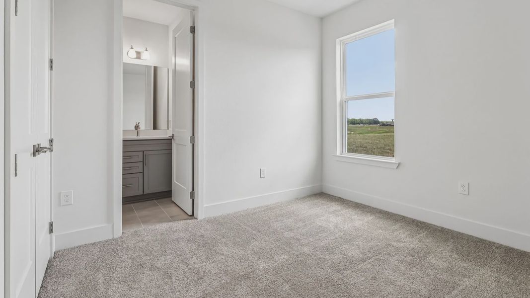 Longleaf Floor Plan Secondary Bedroom with en suite Bath by DRB Homes Lakeside at Satilla in New Homes St. Cloud