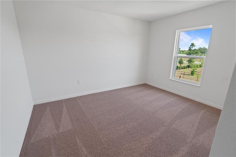 Spacious, unfurnished interior of a new home in Peach Crossings, Winter Haven (Image 17).