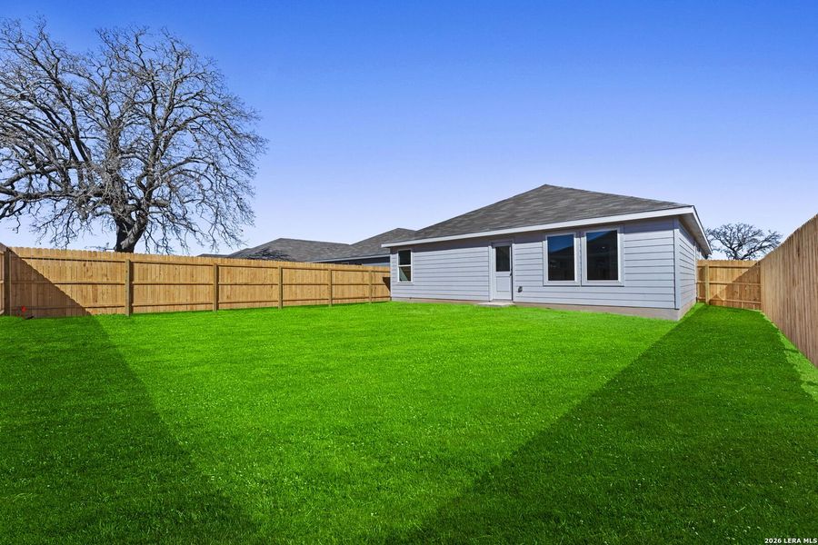 Exterior details and patio area of a home in Friendship Oaks, Fredericksburg (Image 2).