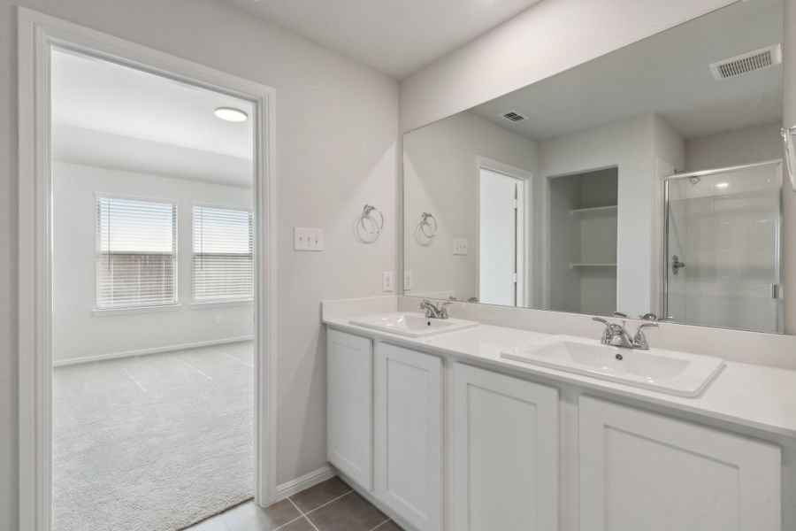 Primary Bathroom in the Hayden home plan by Trophy Signature Homes – REPRESENTATIVE PHOTO