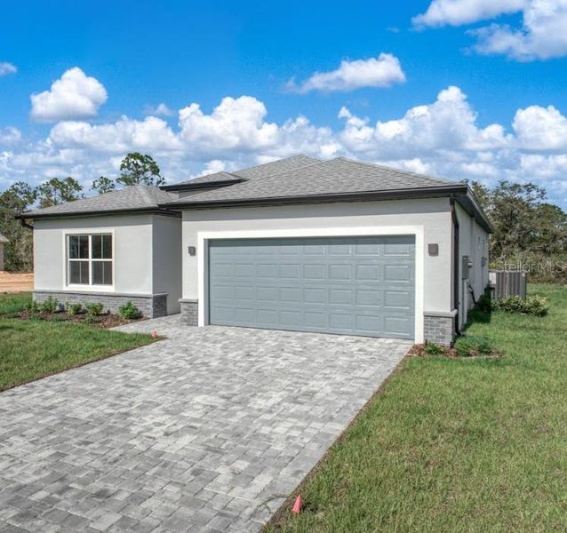 Front exterior of a new home in , Summerfield, FL, highlighting curb appeal (Image 27).