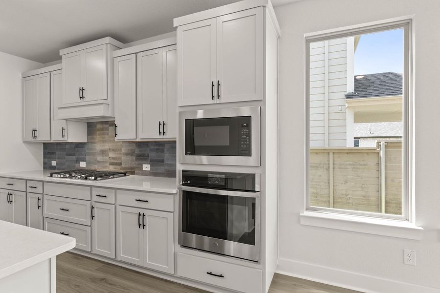 Representative furnished interior of a home built from the Willow by Tri Pointe Homes in Treeline, Justin (Image 5).