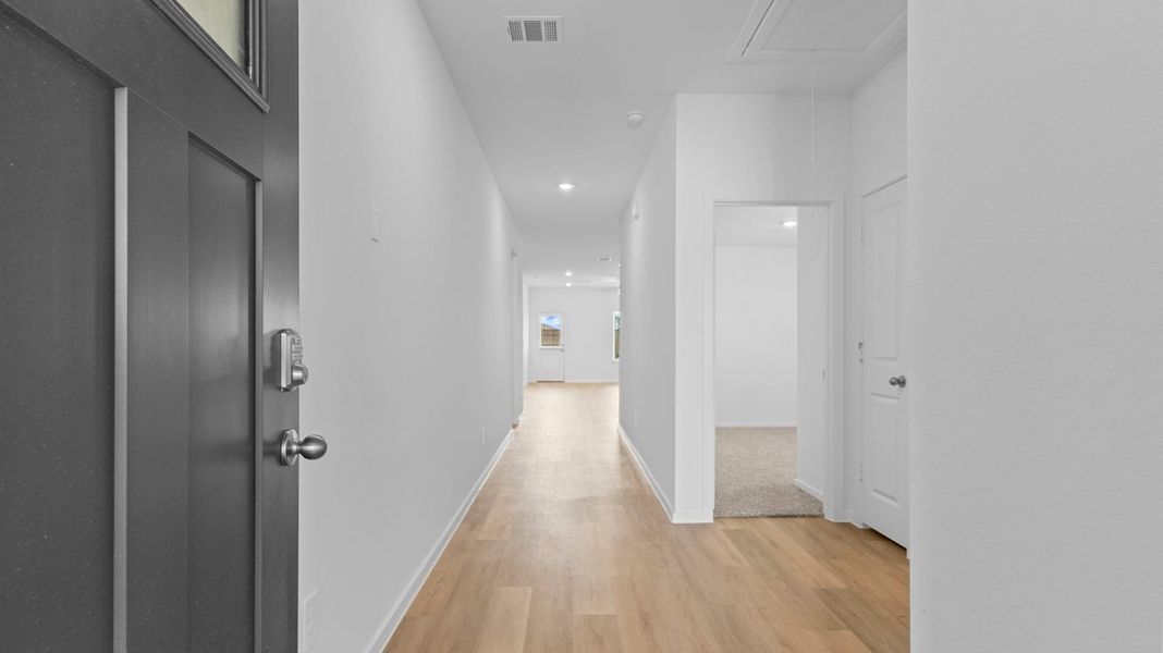 Spacious, unfurnished interior of a new home in Caldwell Crossing, Iowa Colony (Image 14).