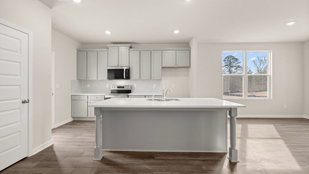 Representative furnished interior of a home built from the Ashmore by D.R. Horton in Brookland Commons, Monroe (Image 6).