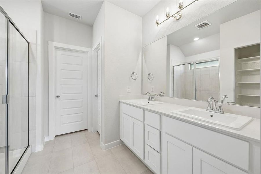 Primary Bathroom in the Oscar home plan by Trophy Signature Homes – REPRESENTATIVE PHOTO Primary Bathroom in the Oscar home plan by Trophy Signature Homes – REPRESENTATIVE PHOTO