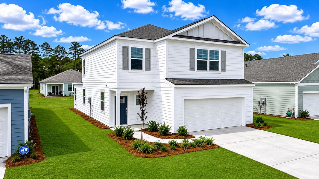 Front exterior of a new home in Hillcrest, Ravenel, SC, highlighting curb appeal (Image 1). Front exterior of a new home in Hillcrest, Ravenel, SC, highlighting curb appeal (Image 1).