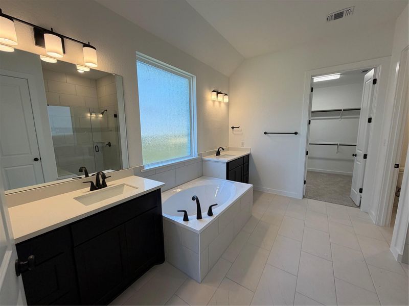 Primary Bath retreat with dual vanities, garden tub & walk-in shower Primary Bath retreat with dual vanities, garden tub & walk-in shower